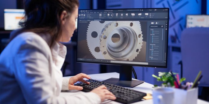 Woman engineer working on new digital prototype using professional construction equipment